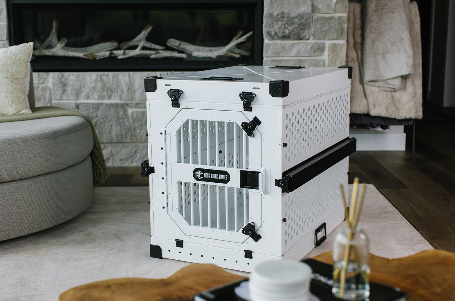Rock Creek Crates' white collapsible dog crate assembled in a living room
