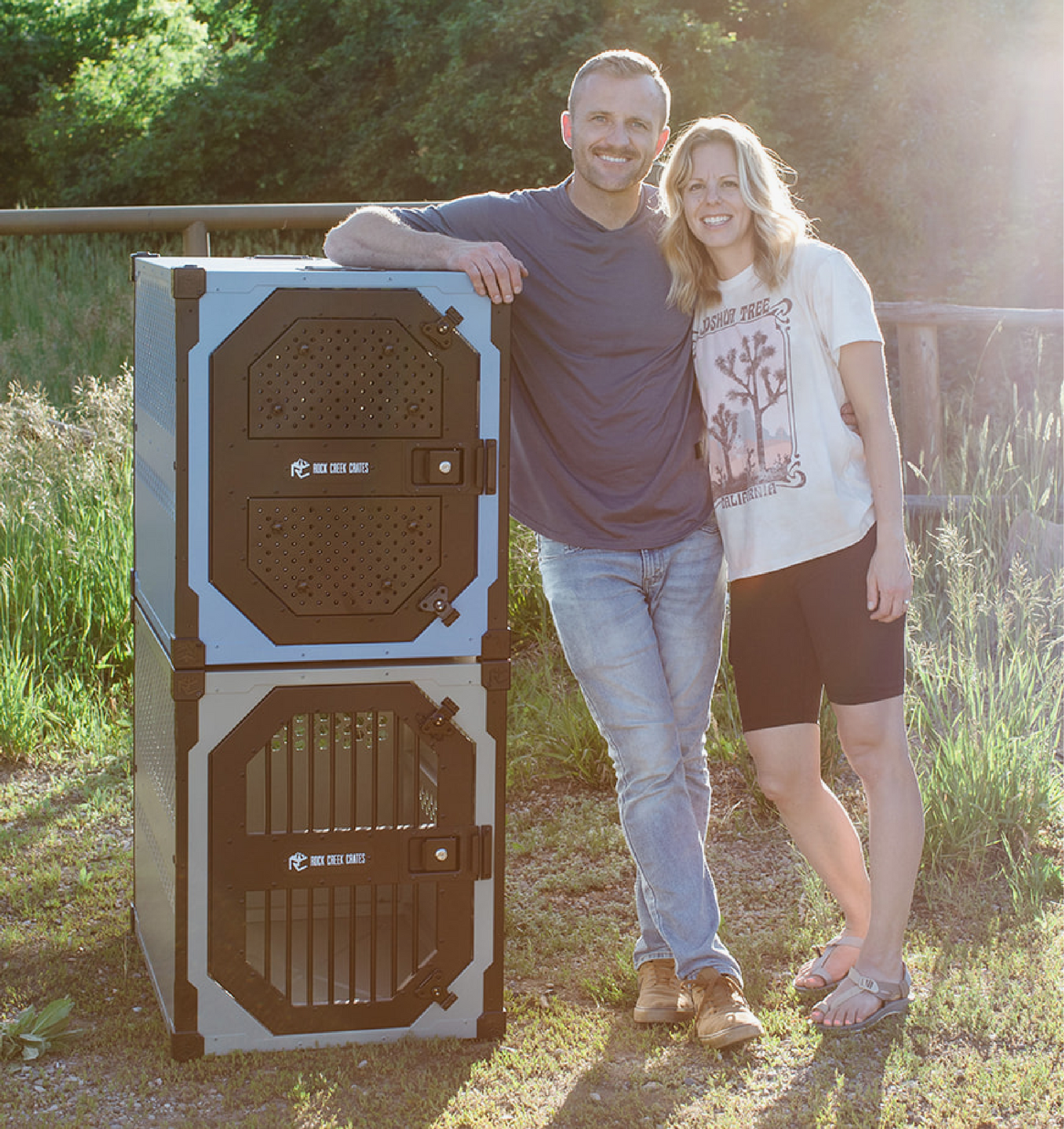 Rock Creek Crates founders next to two stationary dog crates with stackable corners